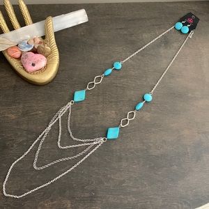 Faux turquoise long necks lace with matching earrings. Never before worn.